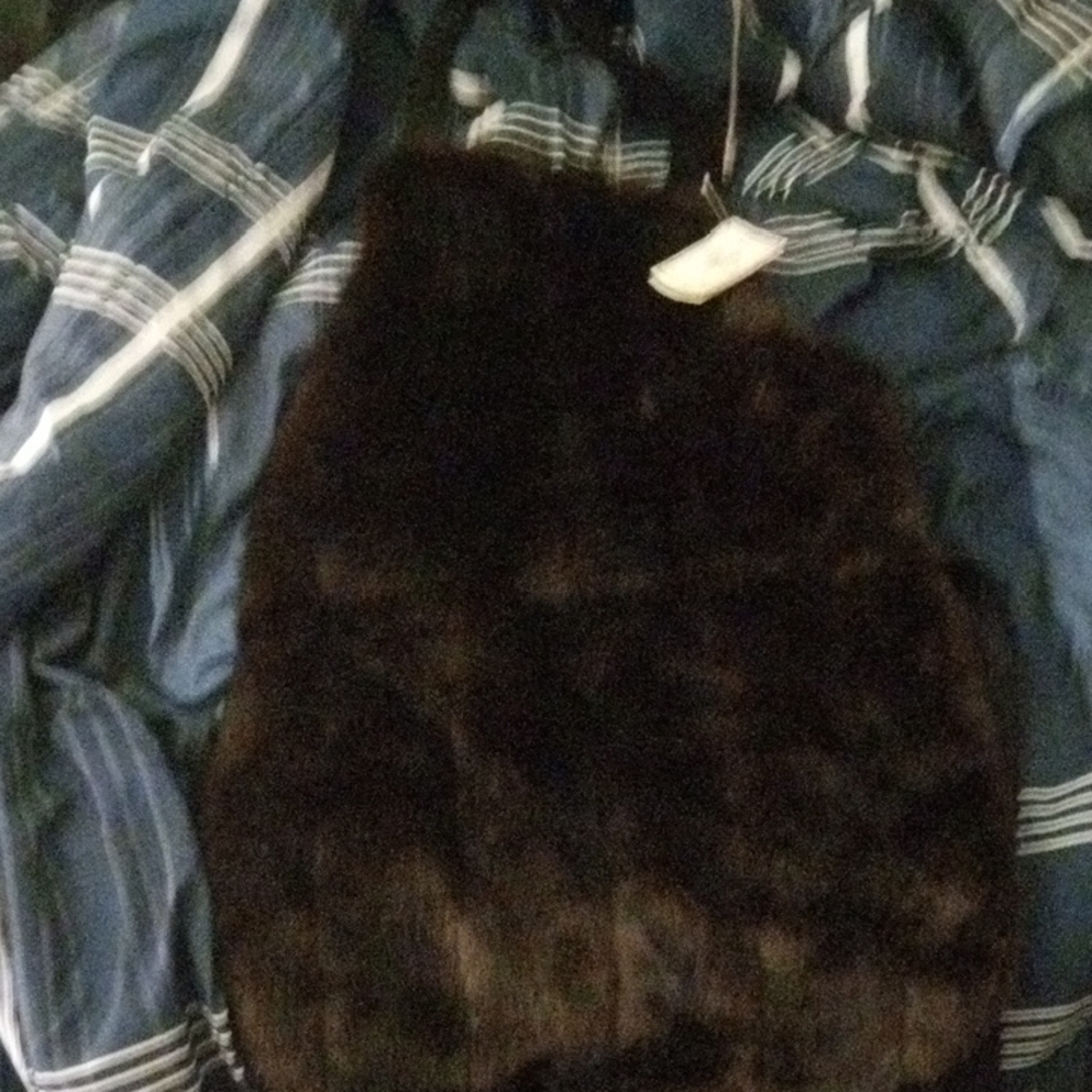 Elegant Black Fur Garment with Dense Texture